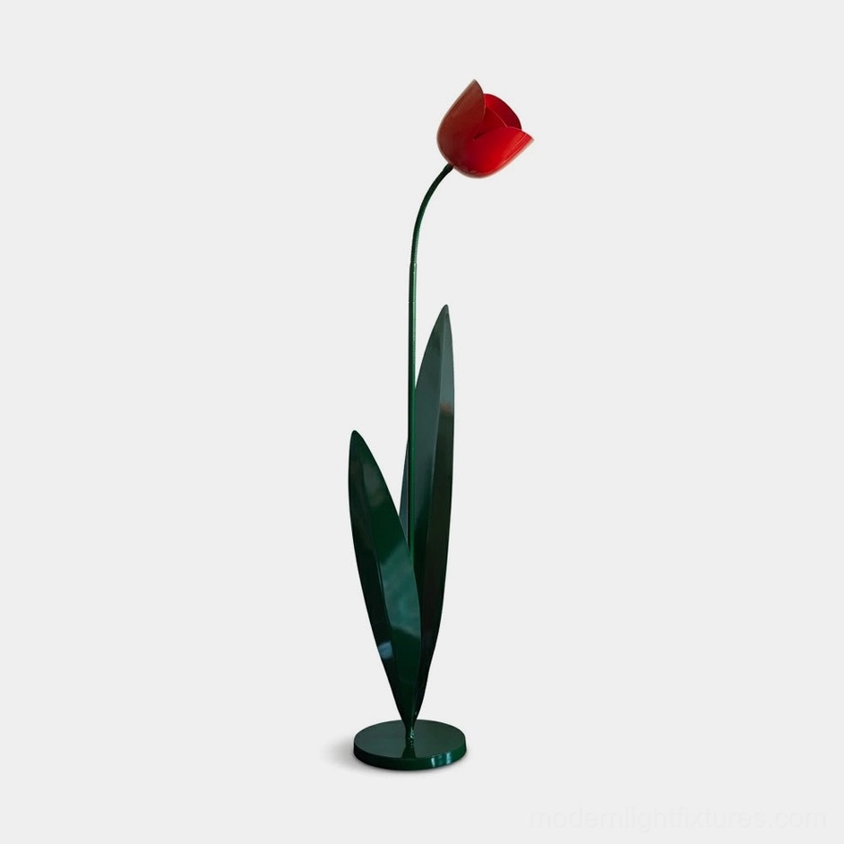Red tulip floor lamp with painted iron bloom, green metal stem and leaves against white studio background – modern botanical floor light