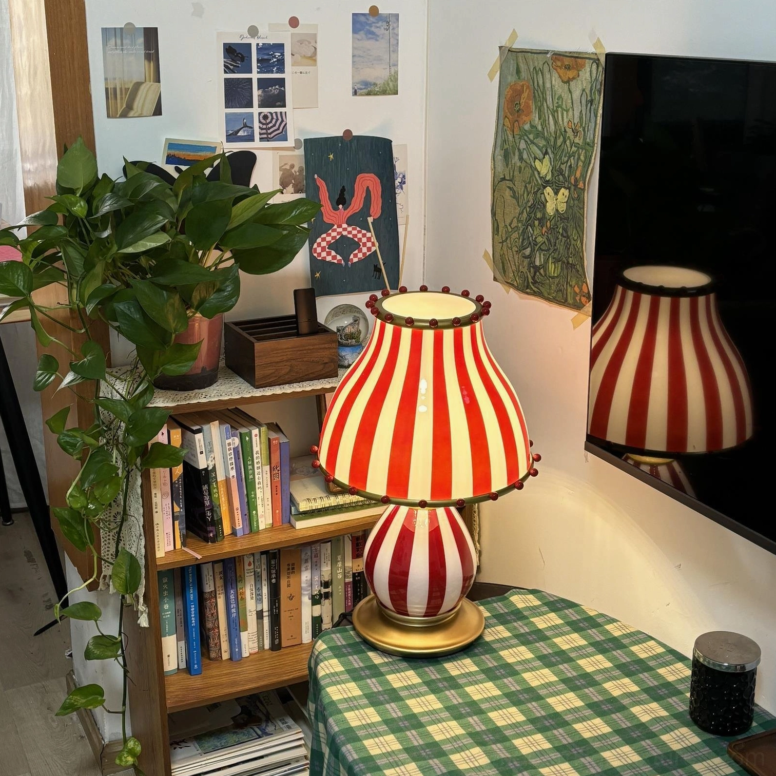Red and white carnival striped table lamp with artistic light distribution
