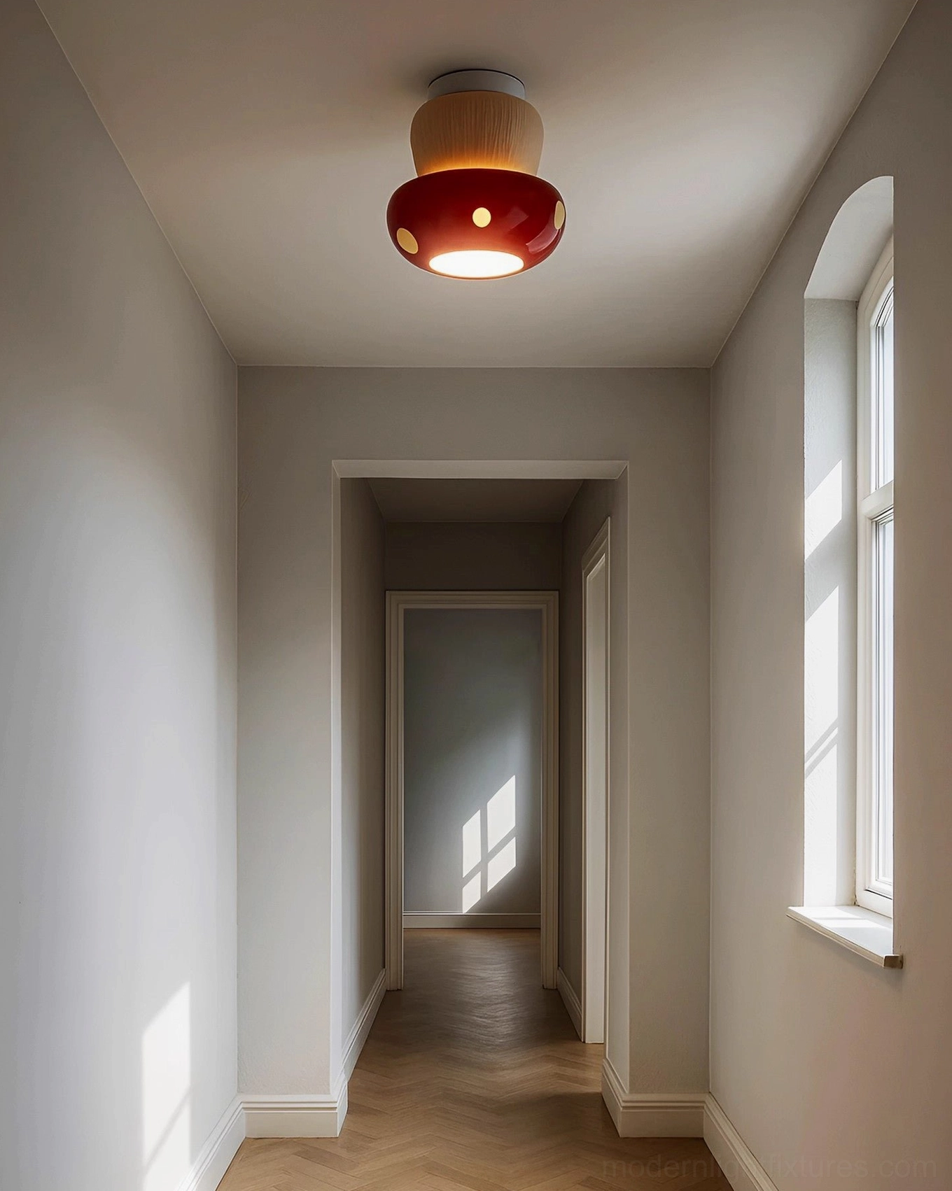 Red and white ceramic mushroom ceiling fixture illuminated in contemporary residential hallway