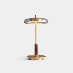Redondo amber glass table lamp with brass base and walnut detail, front studio view