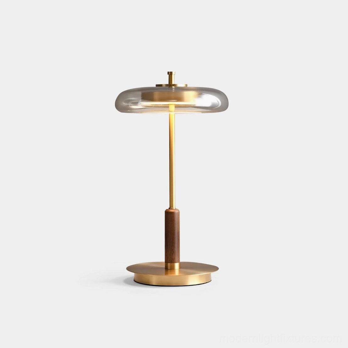 Redondo amber glass table lamp with brass base and walnut detail, front studio view