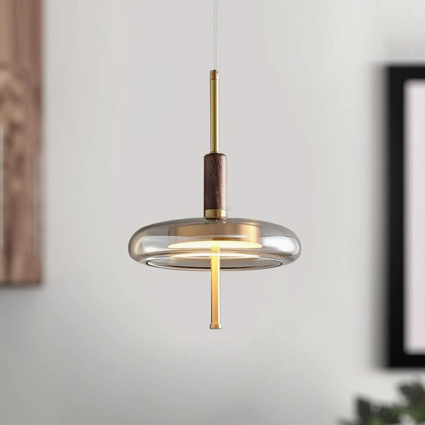 Redondo brass and glass pendant light artistic composition showing modern design aesthetic and material quality