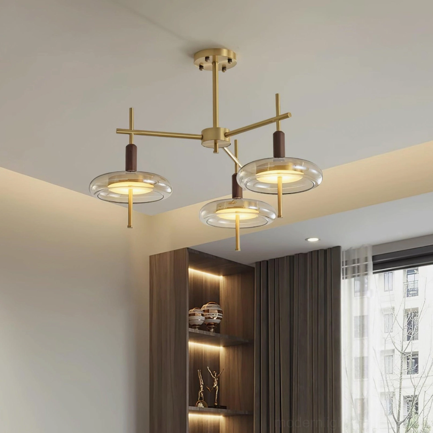 Redondo multi-branch chandelier close-up showing brass metal work and walnut accents