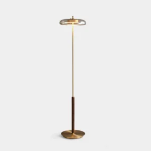Redondo brass floor lamp with walnut disc shade on minimalist white studio background, front perspective view of modern geometric lighting design