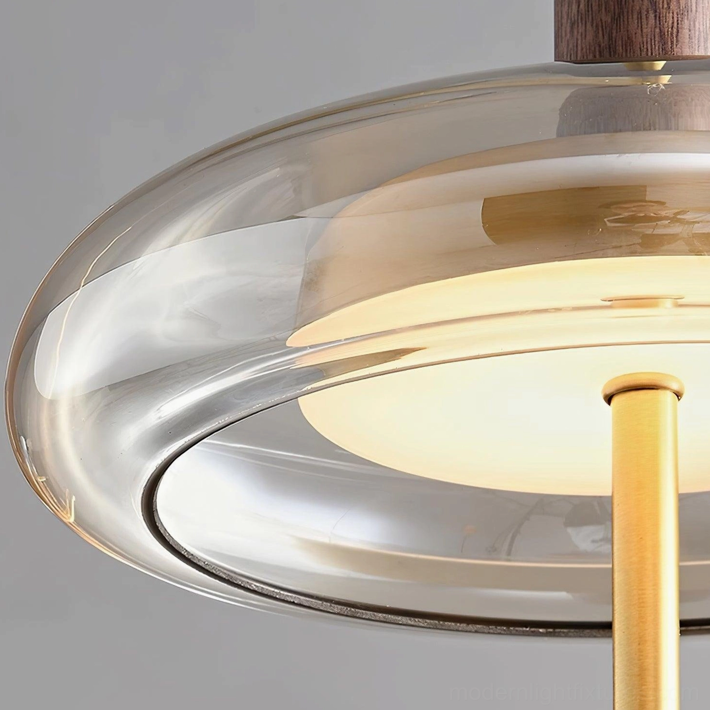 Redondo glass pendant light showing material quality and craftsmanship in polished brass and walnut details