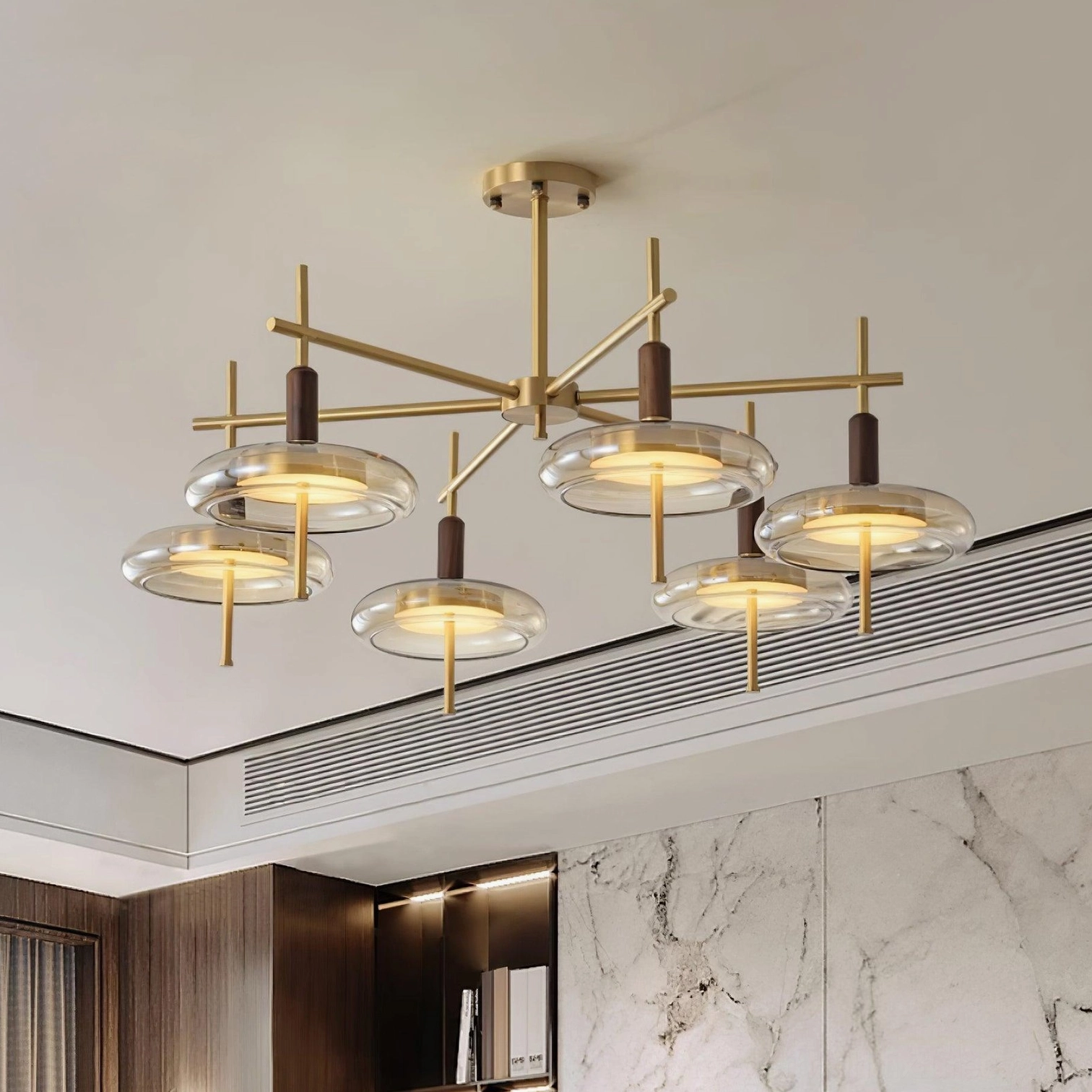 Redondo brass chandelier showing pendant glass discs and mid-century modern aesthetic details