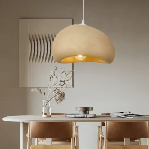 Regina contemporary pendant light installed above dining table in modern minimalist dining room