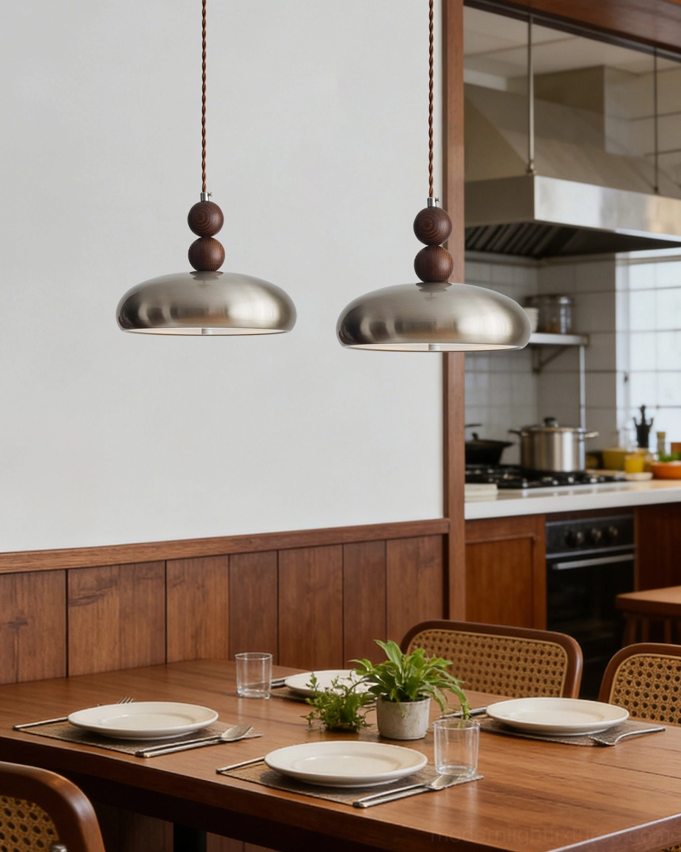 Dual Rellin pendant lights installed in commercial restaurant kitchen with tableware and green plants bistro setting