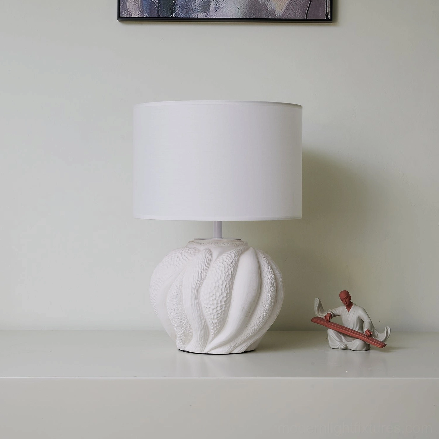 Remi ceramic table lamp architectural profile showing sculptural base texture and drum shade design