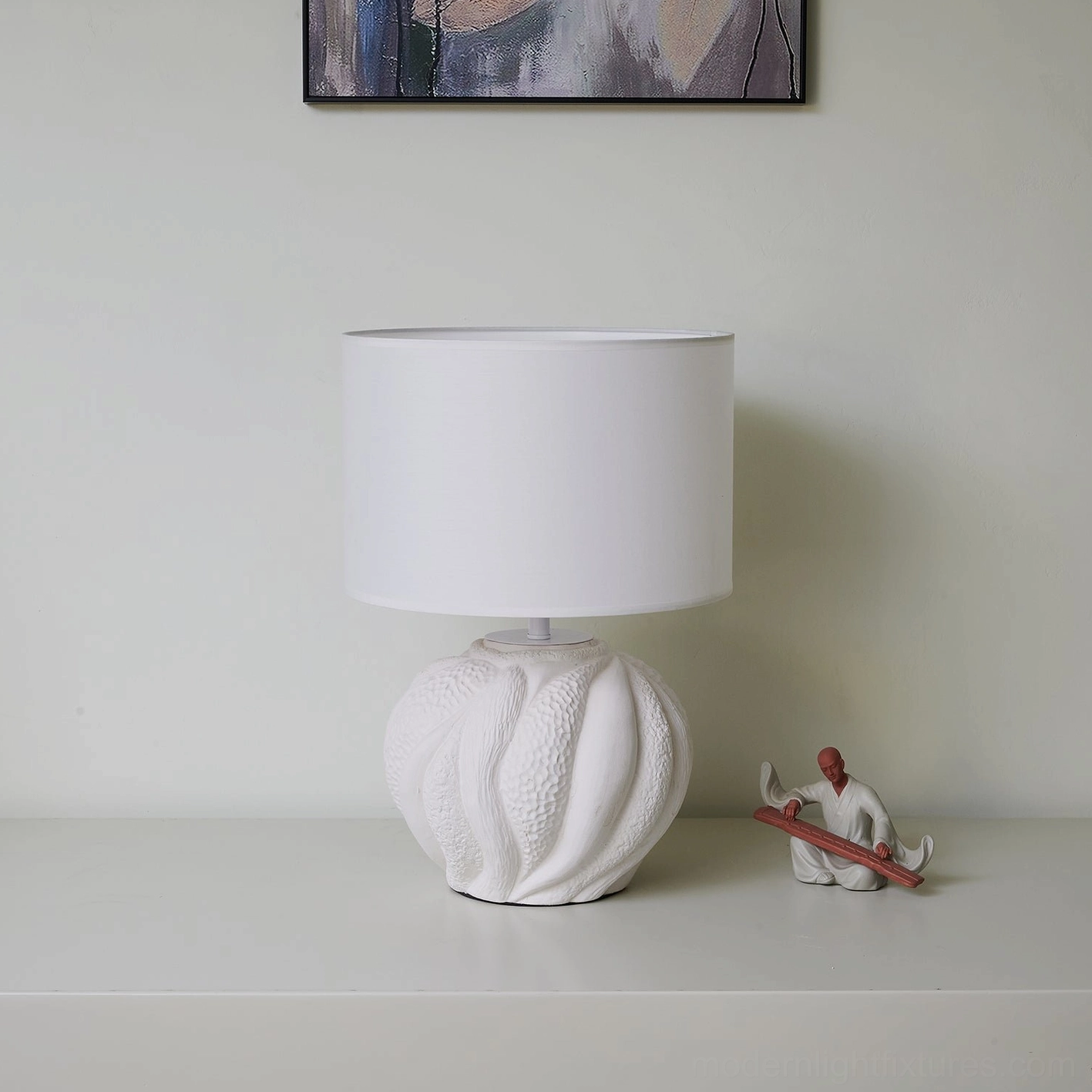 Sculptural Remi ceramic table lamp with white side table and contemporary home decor styling