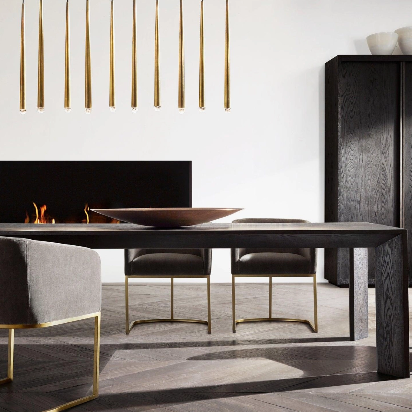 Renaie Brass Cluster Chandelier above formal dining room with fireplace and dark wood table