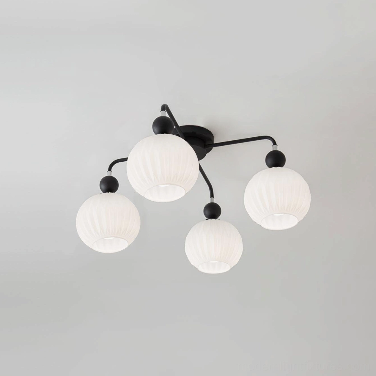 Renee 4-head black ceiling light fixture showing matte finish frame and hand-finished glass shades