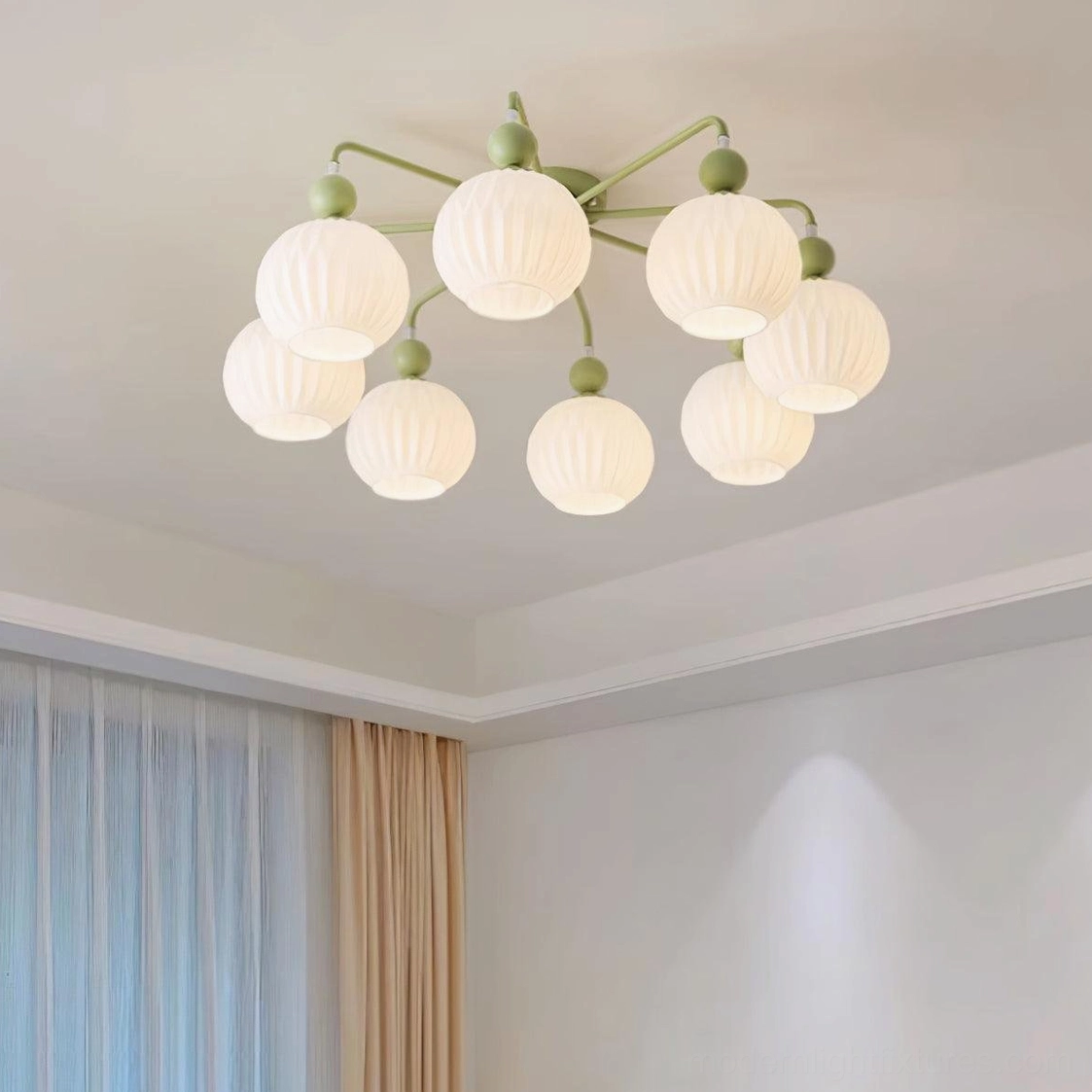 8-head Renee ceiling light installed in minimalist neutral living room with warm frosted glass shades and matte green hardware - overhead view