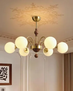 6-light retro globe chandelier with warm brass accents and dark wood details in French classic living room
