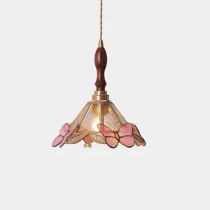 Retro stained glass butterfly pendant lamp with pink butterfly motif on clear glass shade, brass and walnut hardware, front studio view