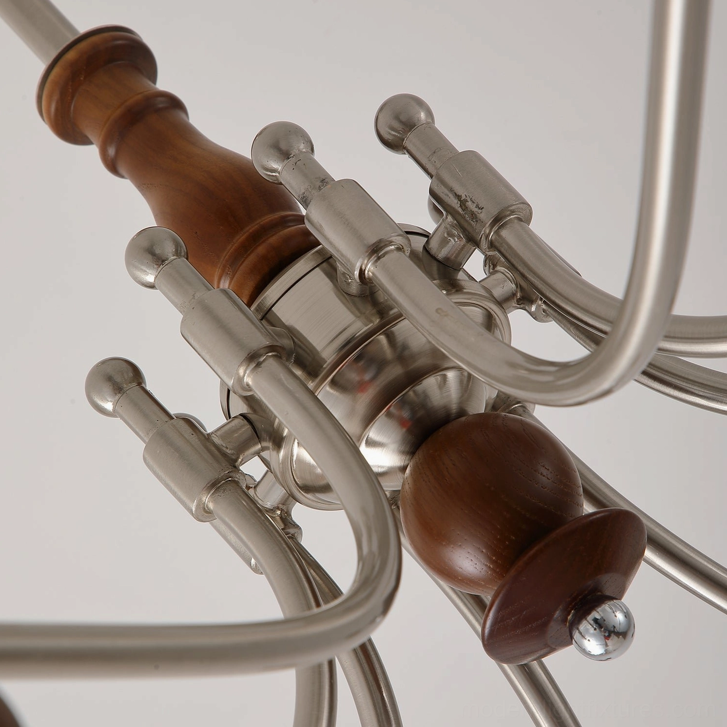 Retro globe chandelier illuminated showing warm light distribution through frosted glass shades