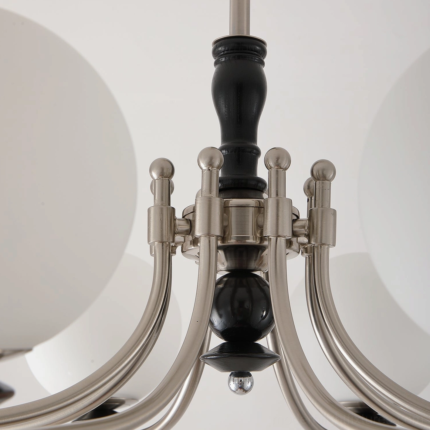 Retro globe chandelier side profile showing the curved metal arms and glass globe positioning