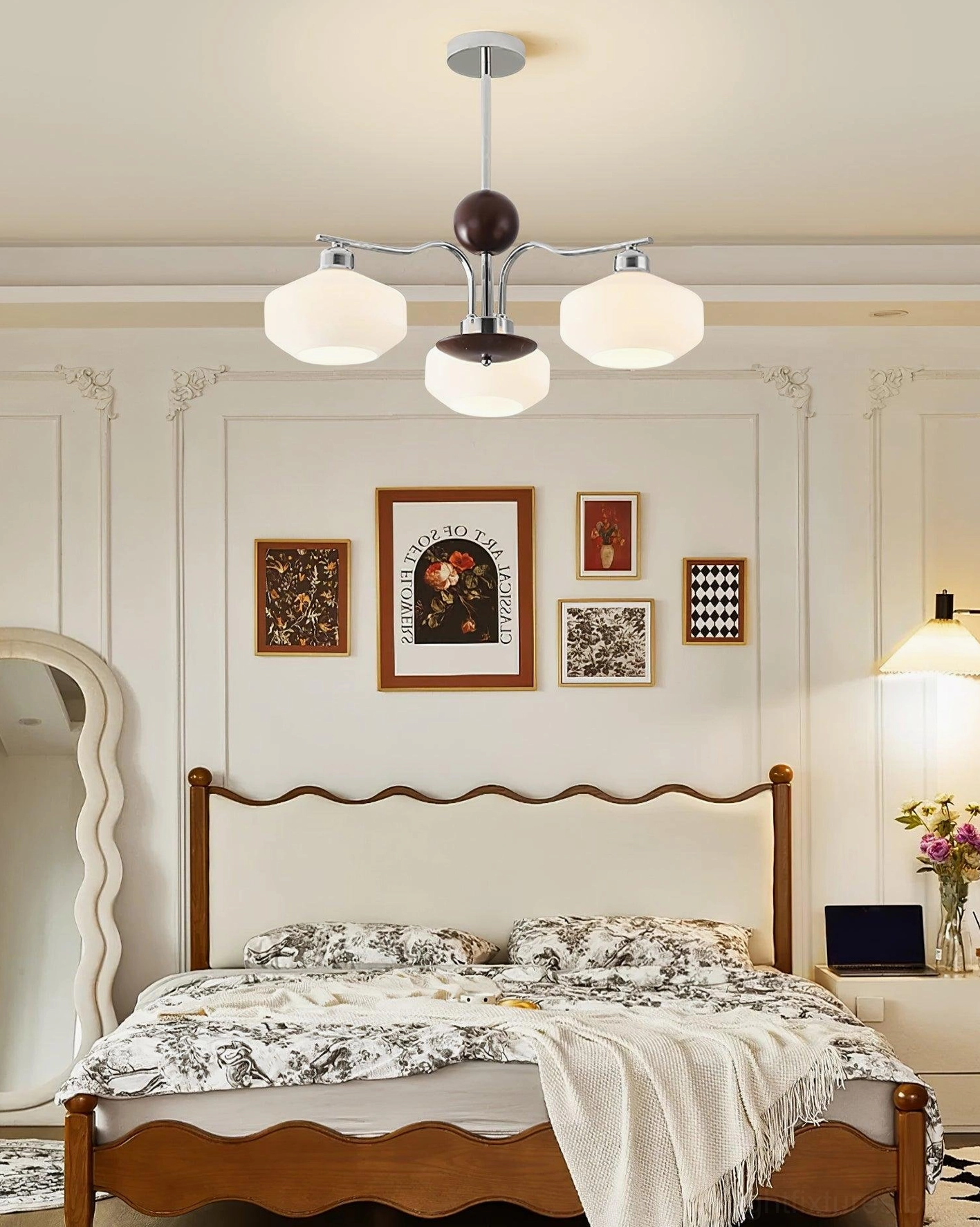 Sputnik chandelier in French vintage bedroom with chrome frame and opal glass shades above bed