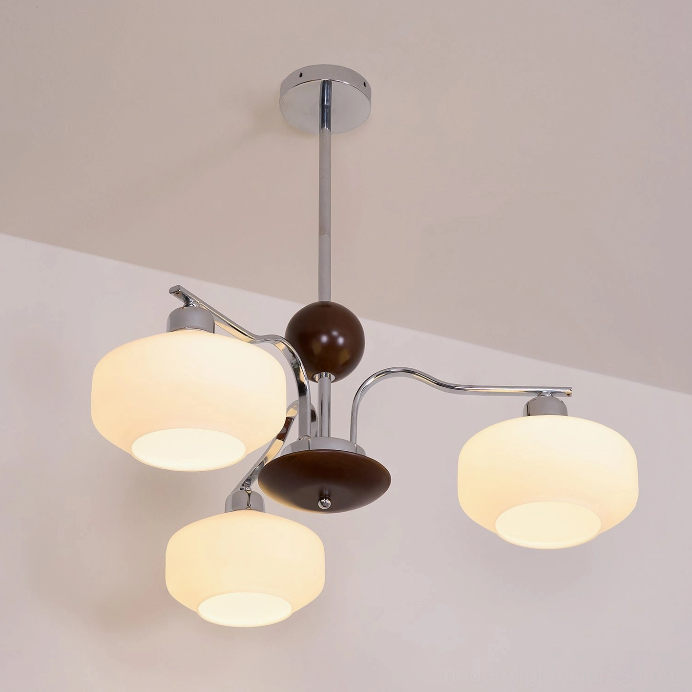 Retro sputnik chandelier three-quarter view showcasing atomic-era design and glass diffuser