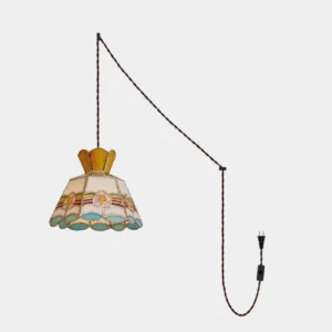 Retro stained glass plug-in pendant light with hand-cut colored glass panels in amber pink blue and green arranged in a floral pattern with brass frame and braided cord displayed against white background