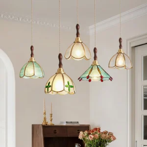 Multiple retro Tiffany pendant lights hanging in American-style entryway with mixed stained glass shades and rustic brass accents, interior design scene