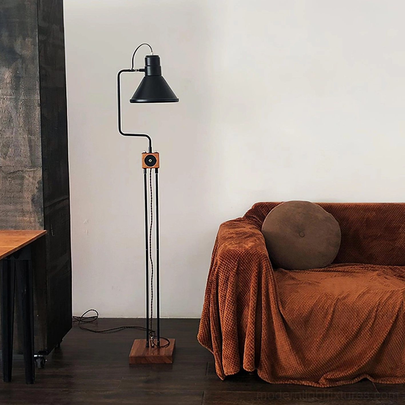 Industrial retro floor lamp three quarter view living room brown sofa ambient lighting