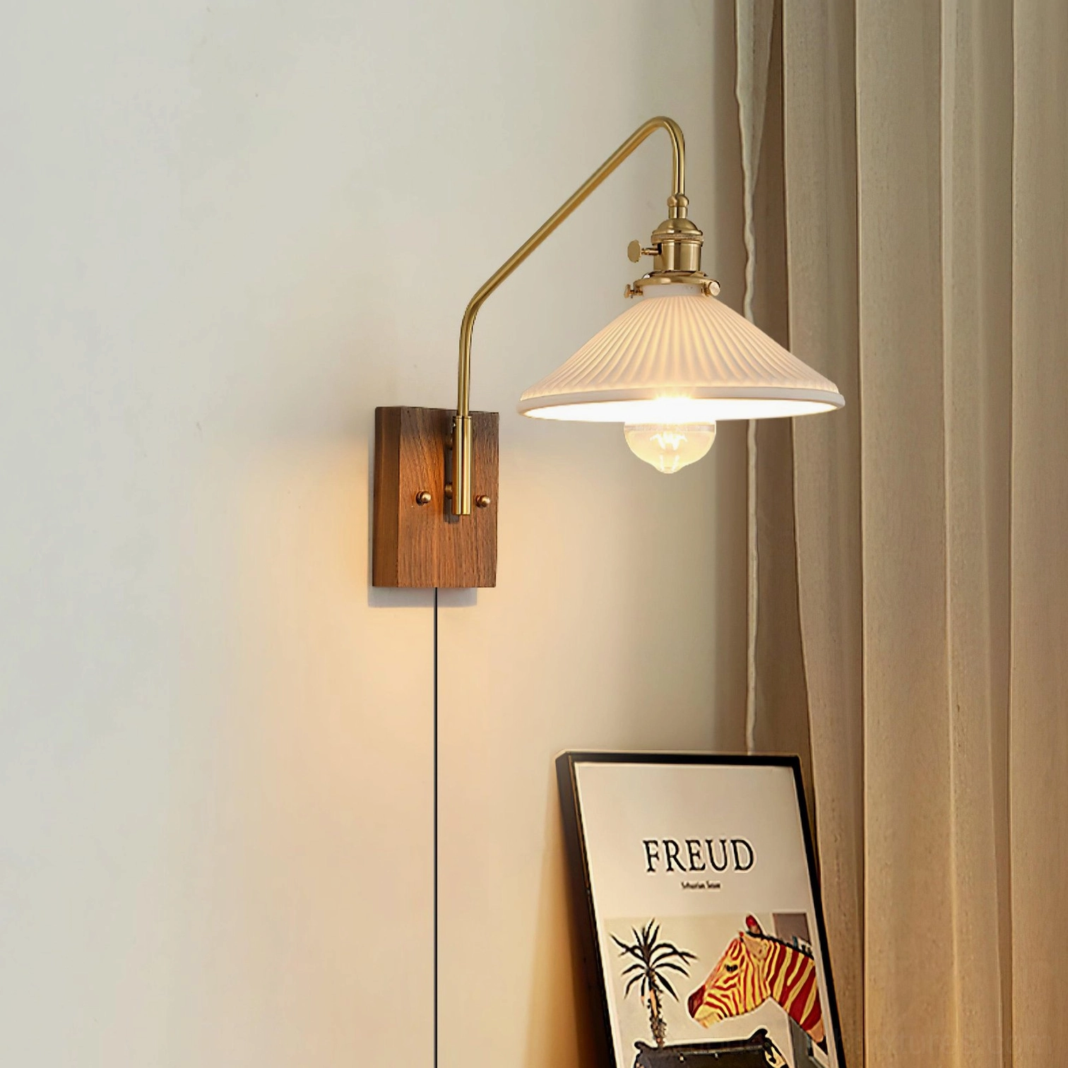 Retro brass wall sconce mounted above bathroom vanity mirror as damp-rated fixture