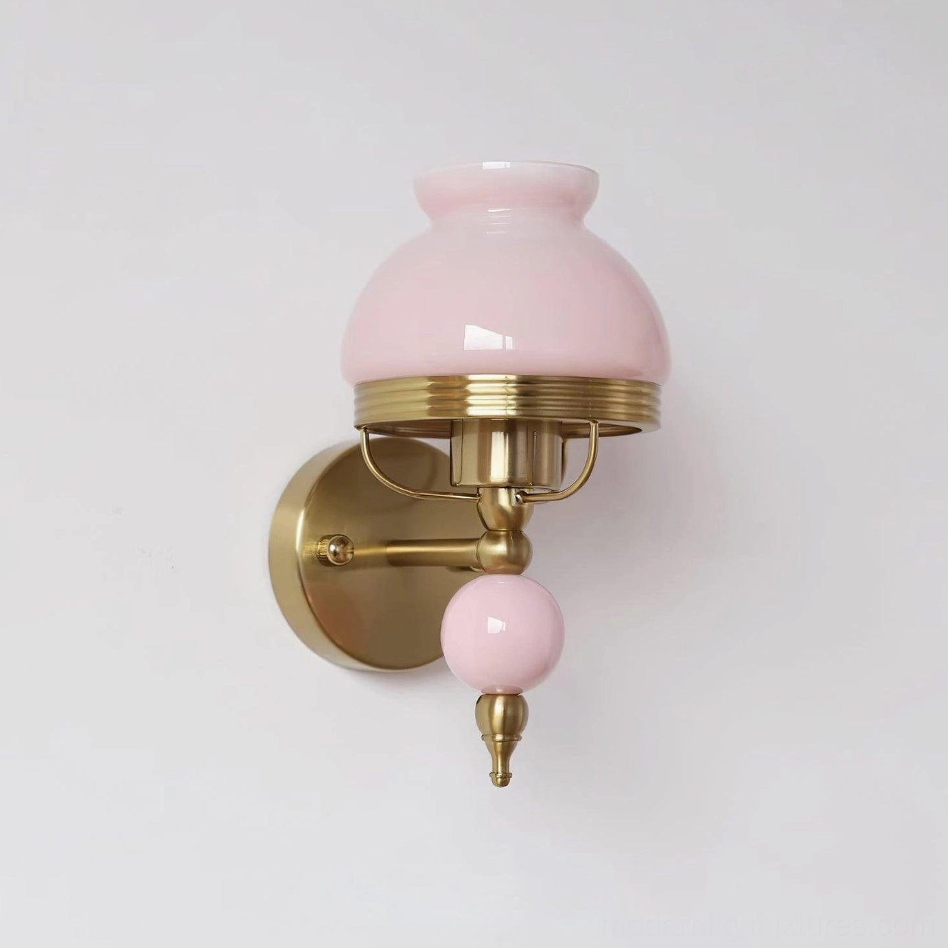 Retro wall sconce featuring brass hardware and decorative frosted glass with floral pattern