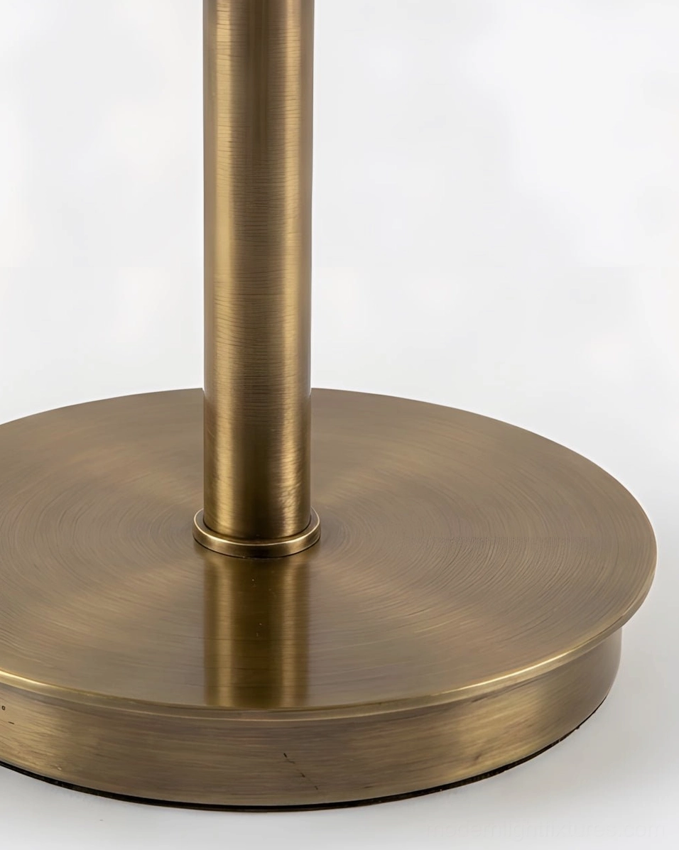 Retrovia alabaster table lamp profile side view showcasing weighted brass disc base, slender stem, and natural stone bowl proportions and design elegance