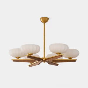 Reya 6-arm mid-century modern wood pendant chandelier with walnut arms and polished brass hardware in studio lighting, front view