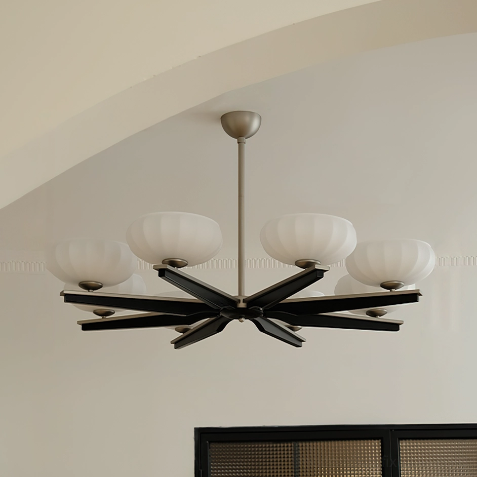 Reya modern pendant chandelier with matte black wood arms and white ribbed glass shades, arched ceiling installation detail