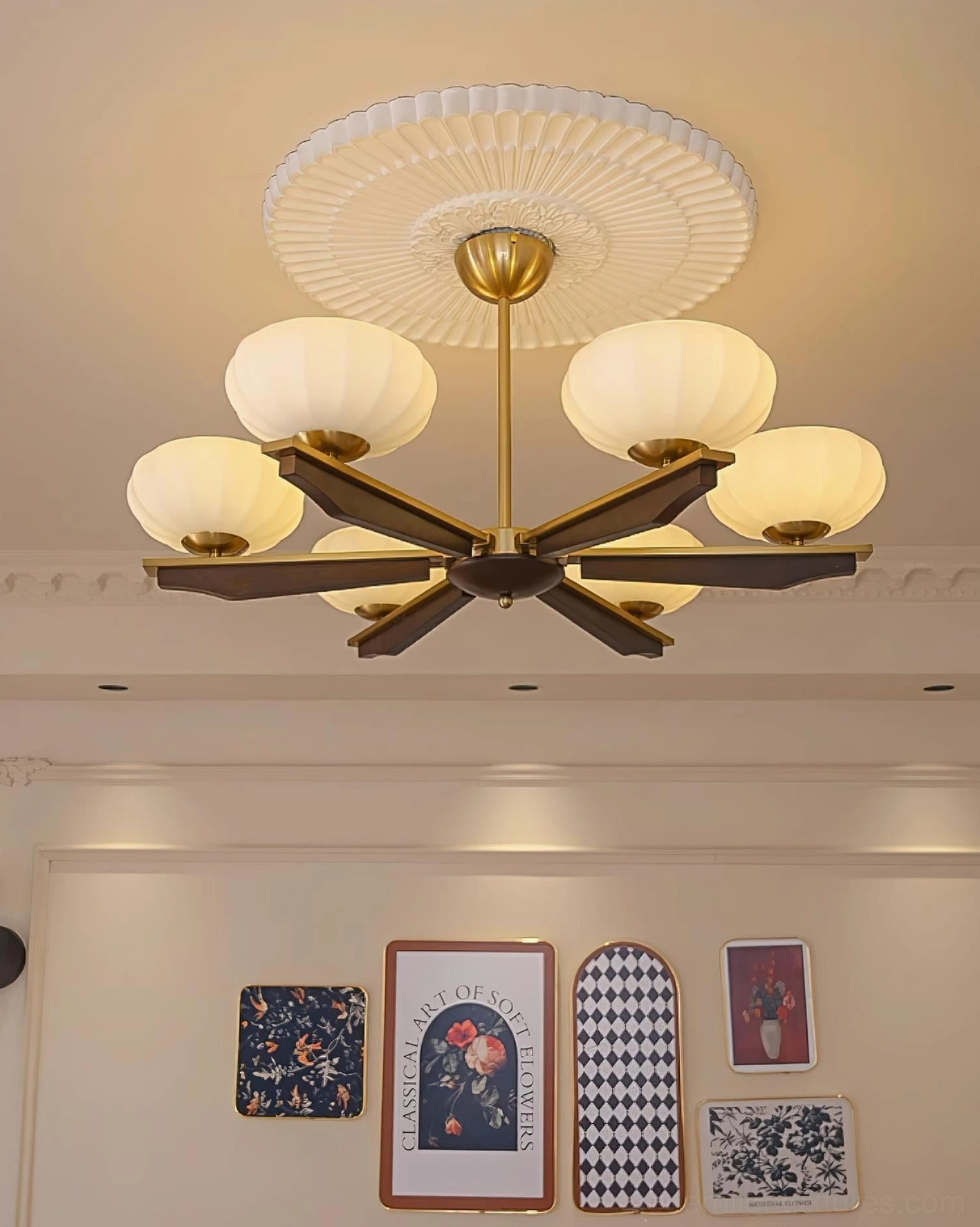 Reya mid-century modern wood chandelier with decorative ceiling medallion and walnut arms, polished brass accents, upward view