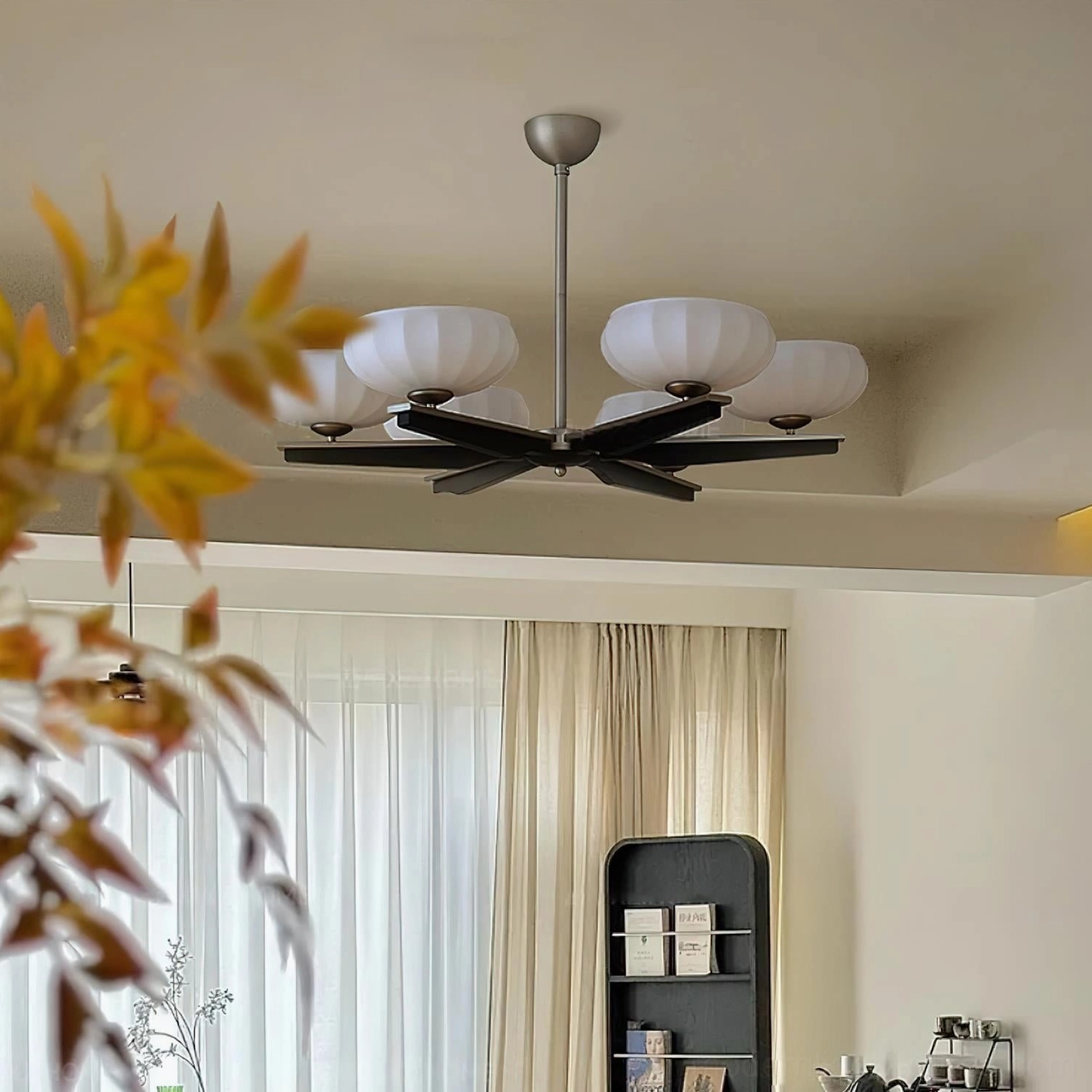 Reya mid-century modern pendant chandelier in contemporary dining room, statement lighting fixture above table setting