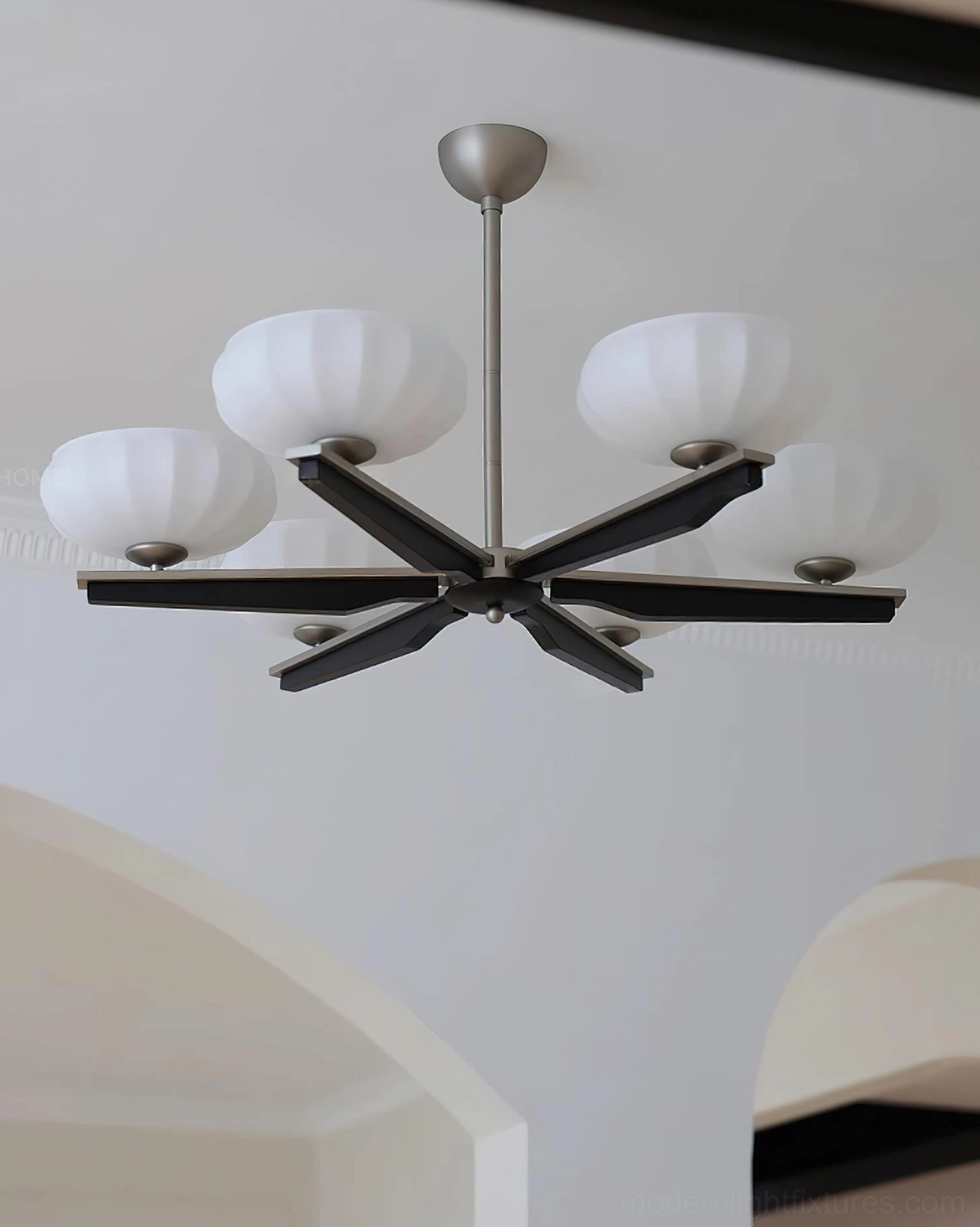 Reya wood chandelier in contemporary living space, showcasing warm light diffusion through ribbed glass shades