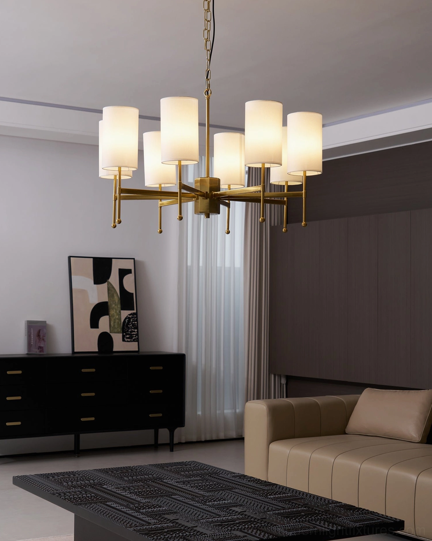 Close-up of Rhodes chandelier brass metalwork and cylindrical white fabric shade connection