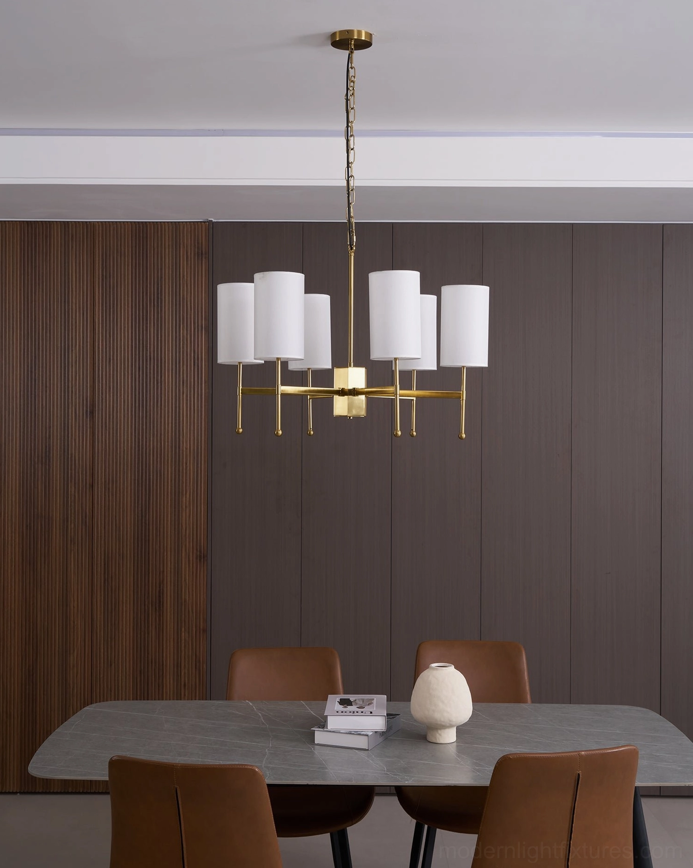 Rhodes mid-century modern chandelier in dining room setting with warm ambient illumination