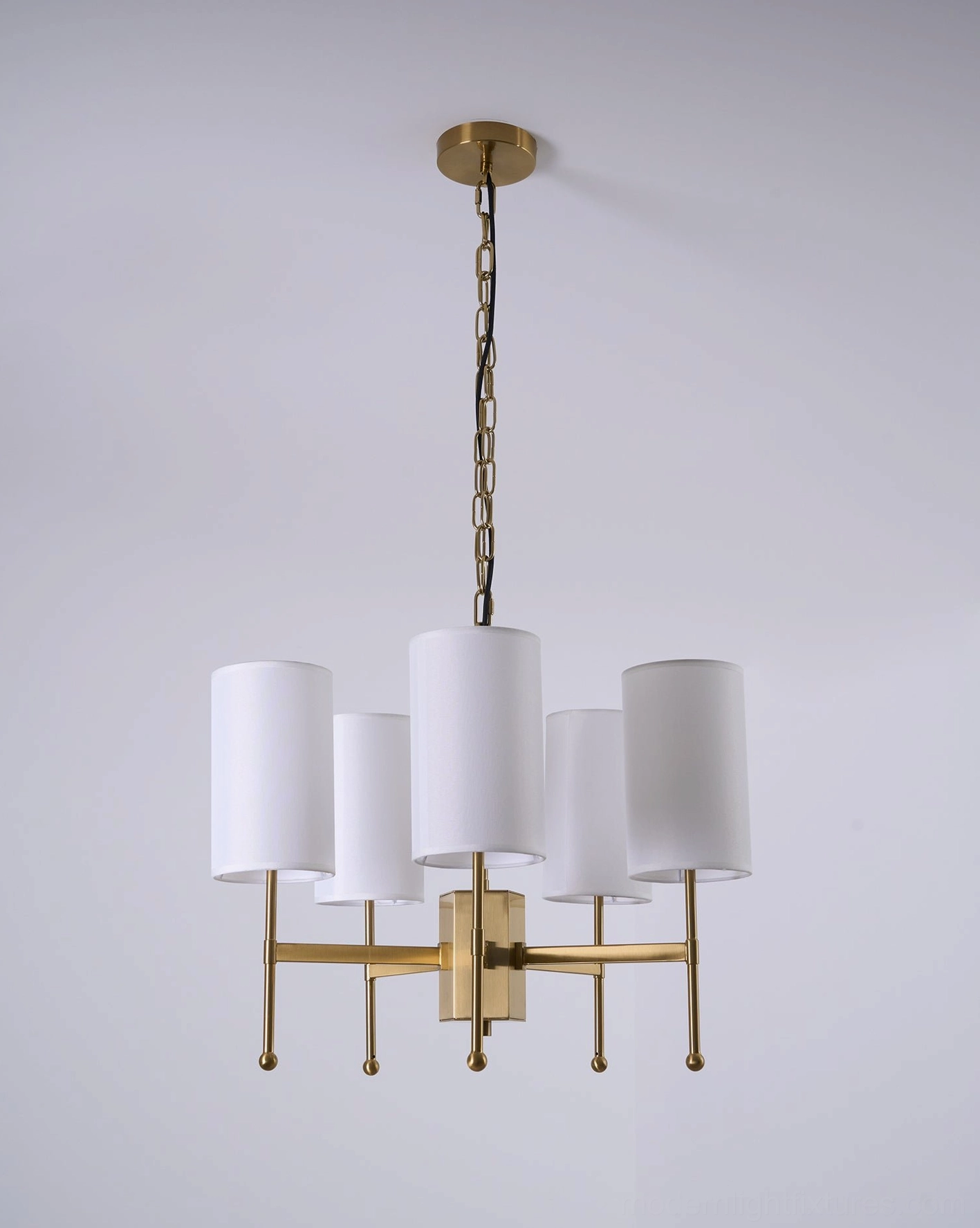 Evening ambiance created by illuminated Rhodes mid-century modern chandelier - warm light effect