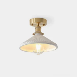 Rialto semi-flush ceiling light fixture with brushed gold mounting and white ribbed ceramic shade in studio setting