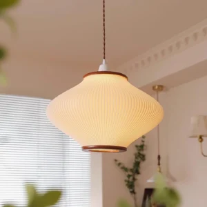 White and walnut minimalist pendant lamp in residential interior with window blinds, three-quarter perspective view