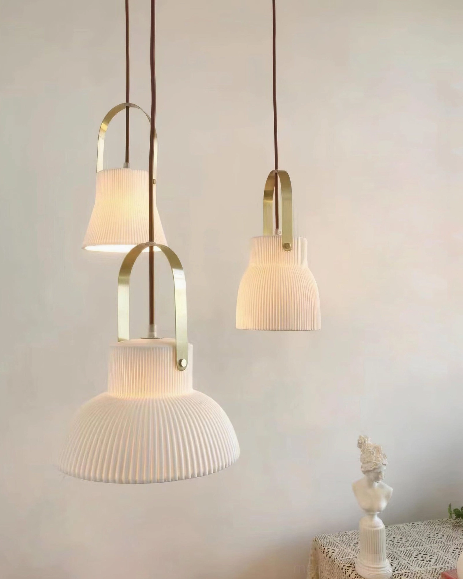 Ribbed ceramic pendant light installed over dining area in modern home interior
