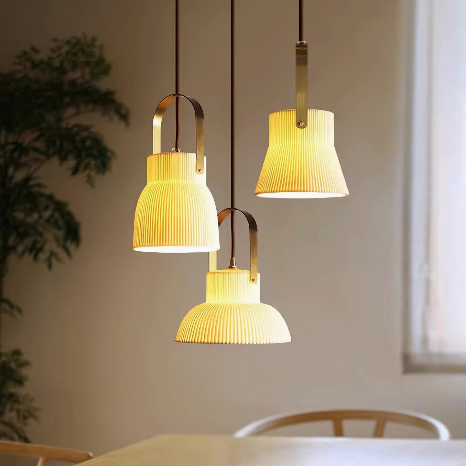 Ribbed ceramic pendant light fixture showing warm ambient glow and shadow patterns