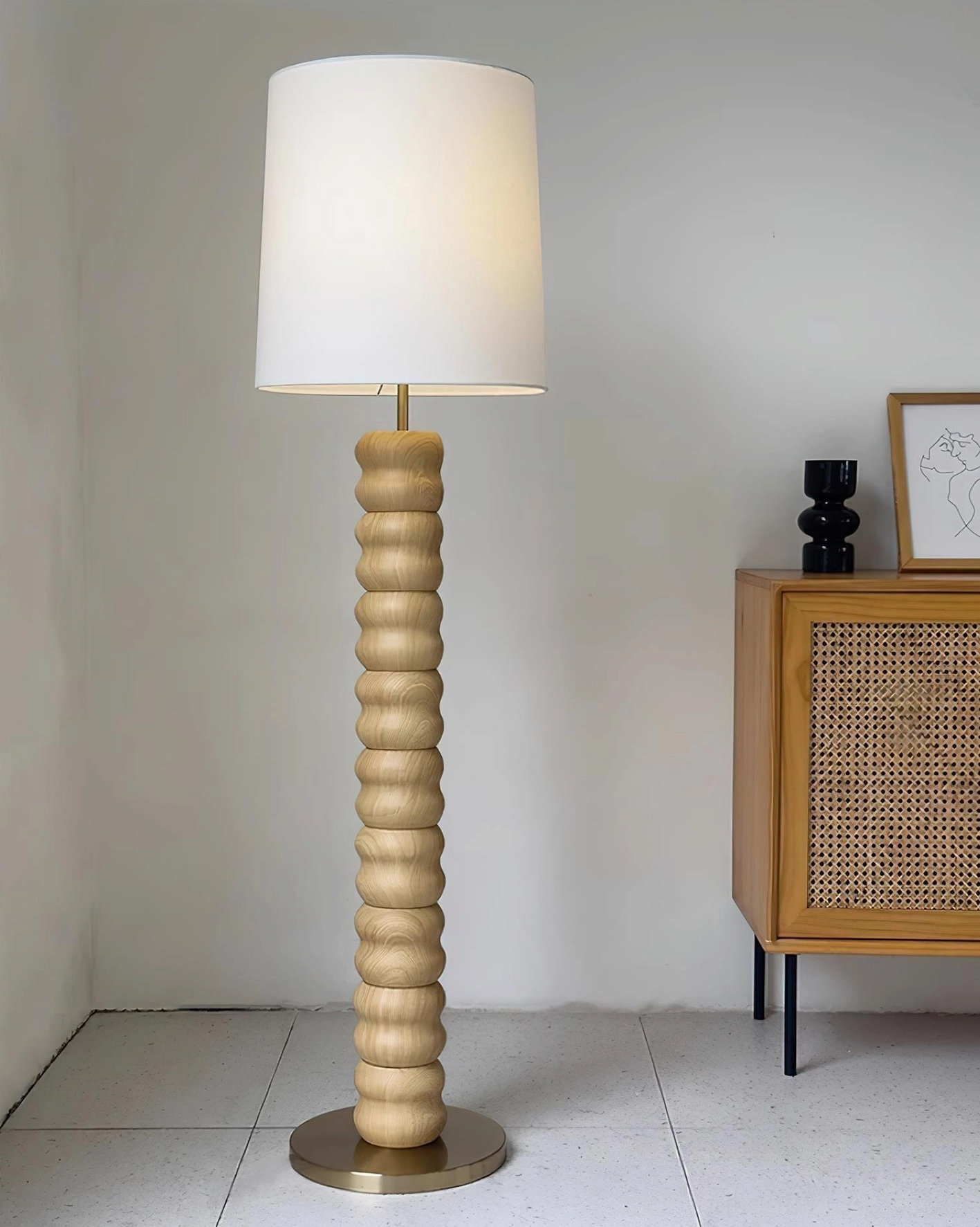 Silver ribbed glass floor lamp base with chrome hardware in modern bedroom with mirror