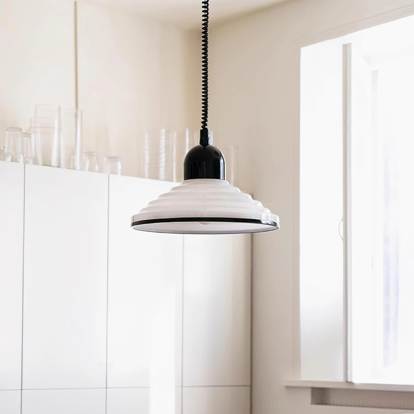 Ribbed metal pendant lamp in living space showing scale and proportion with furniture and architectural elements