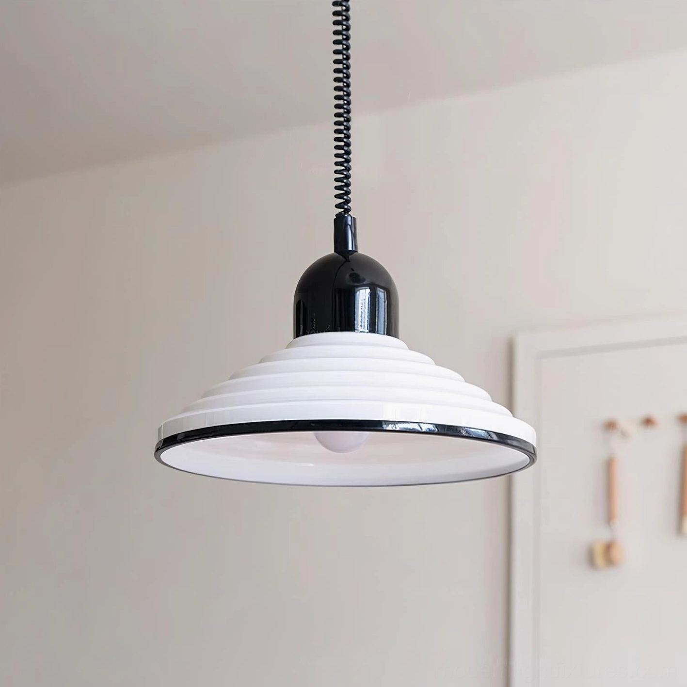 Ribbed metal pendant light in black and white finish, main product photography for e-commerce display