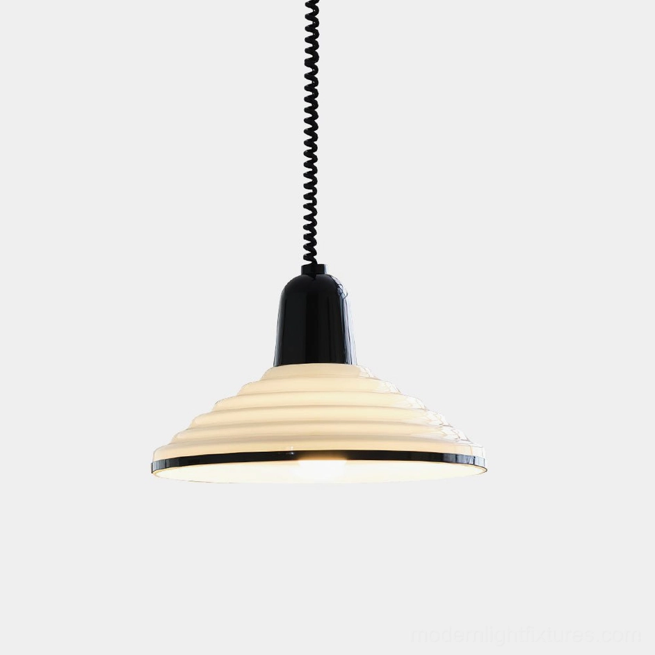 Modern ribbed metal pendant light with cream finish and black top, hanging against plain white background with warm internal lighting