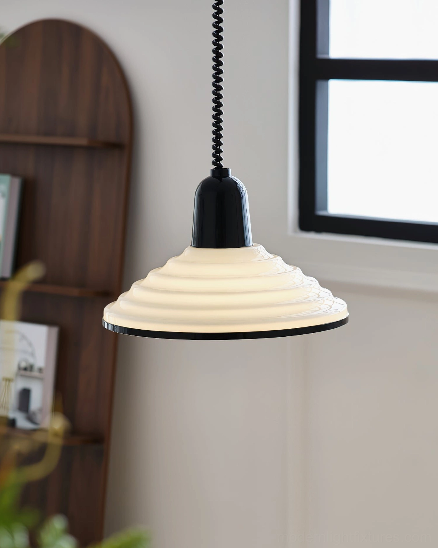 Ribbed pendant light hanging in bright residential interior with natural window lighting, minimalist home décor