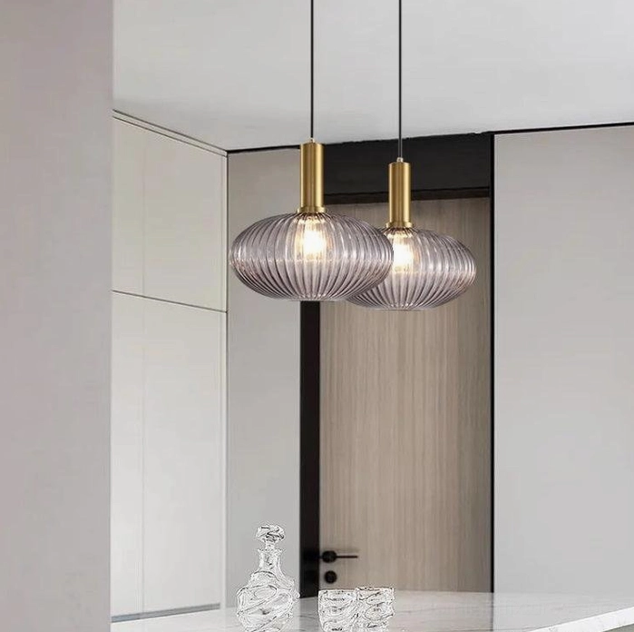 Overhead perspective of ribbed glass pendant lamp installation showing light distribution and architectural integration
