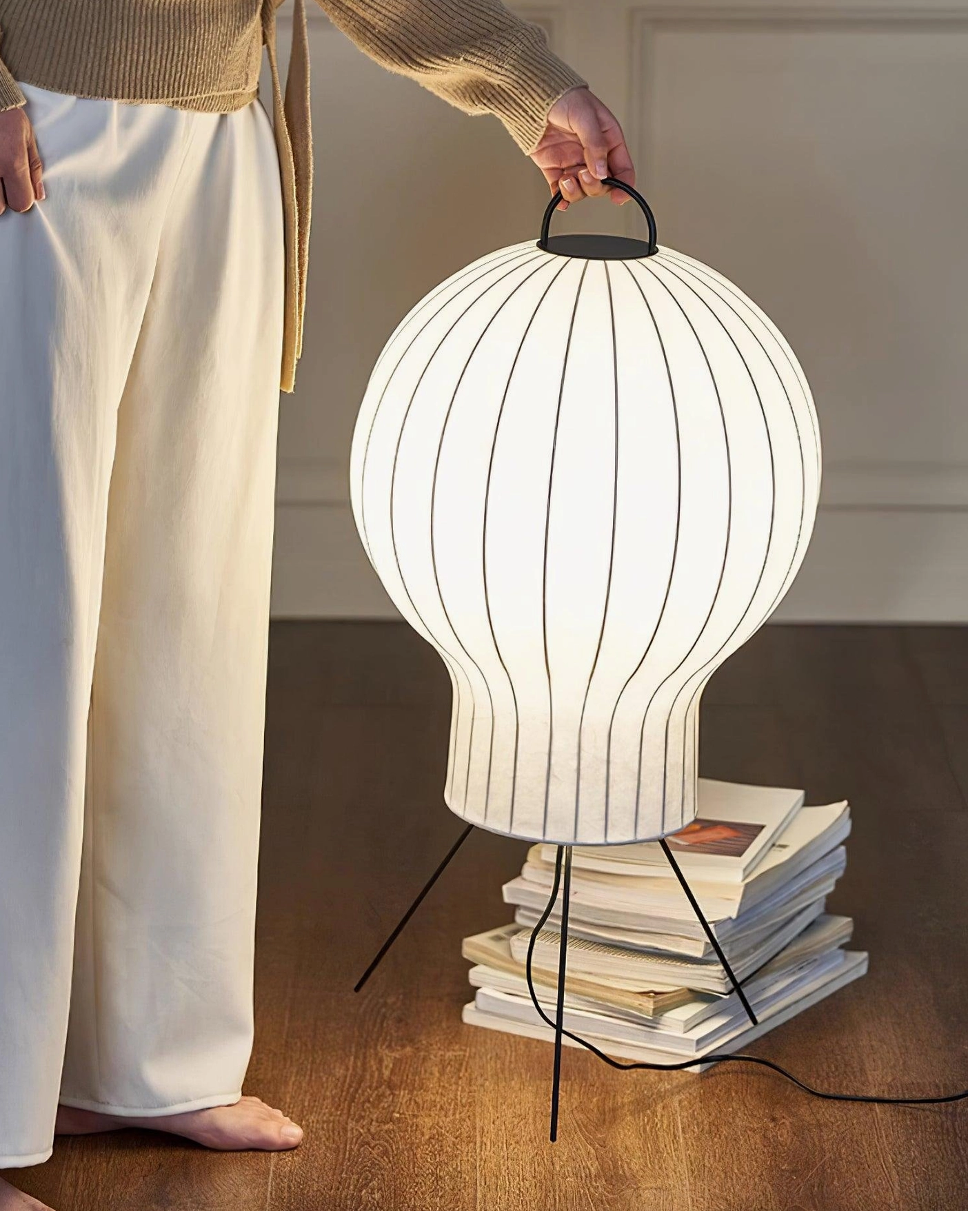 Ribbed silk shade floor lamp with warm light glow in relaxation space