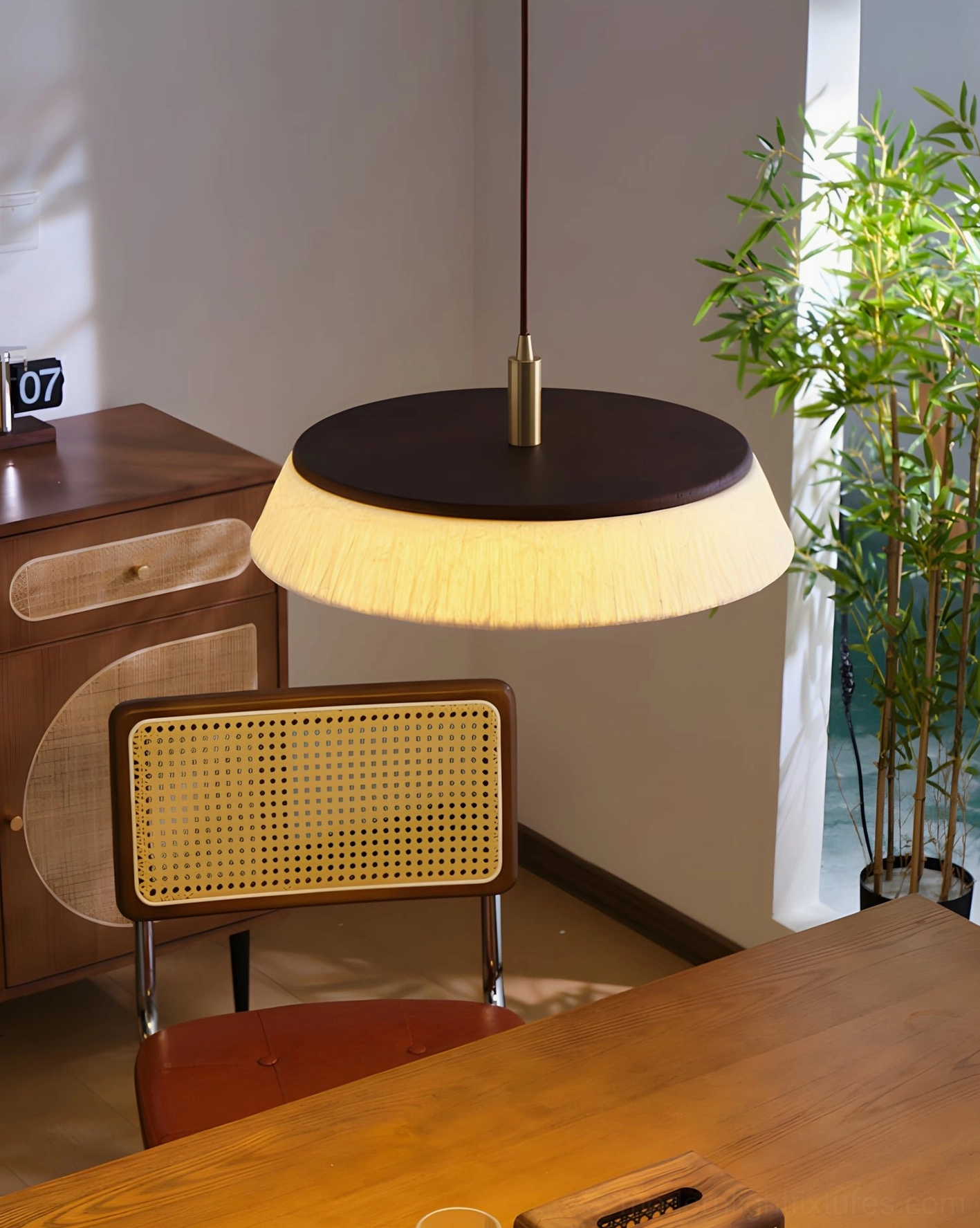 Rice paper pendant light showing internal bottom diffuser and soft ambient light distribution, warm glowing bulb