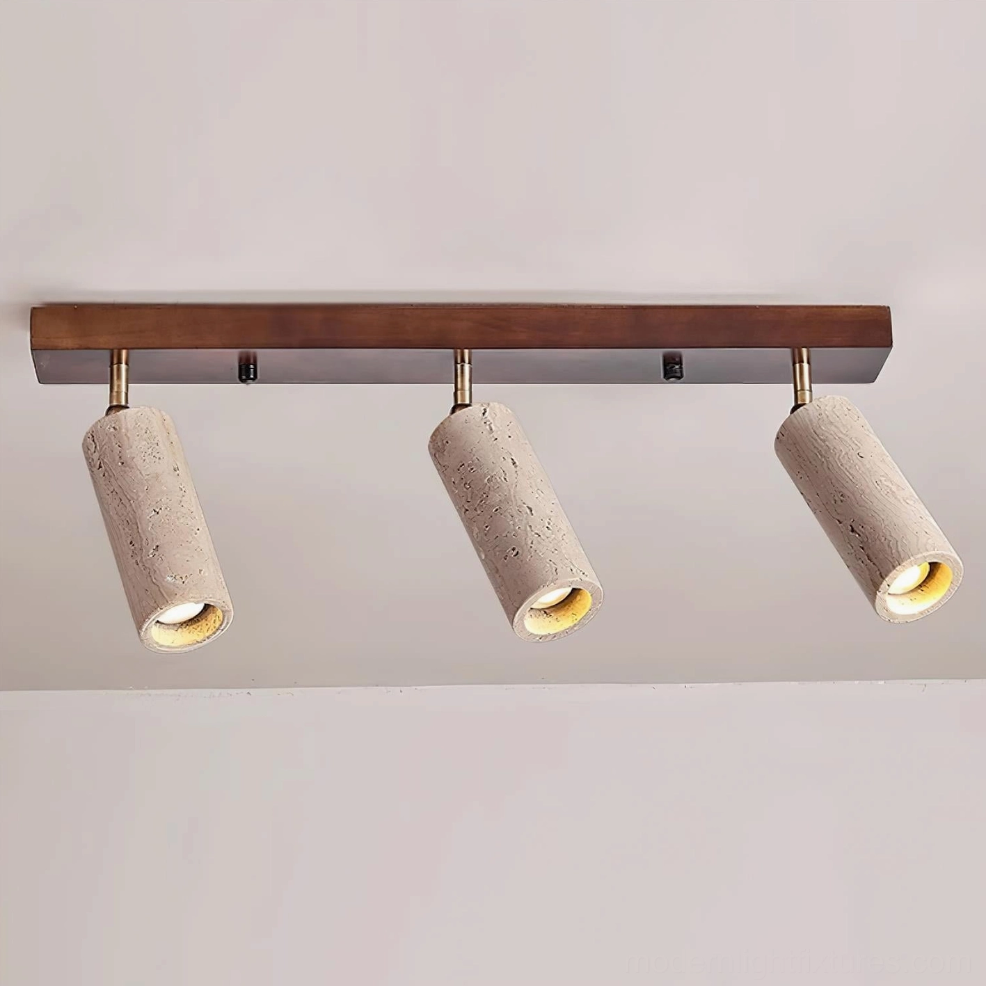 Ricerca 3-head track ceiling light in damp-rated bathroom installation with natural stone travertine shades